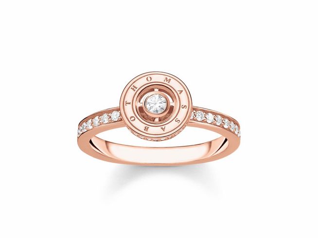 Silber vergoldeter Ring von Thomas Sabo in Roségold mit Zirkonia-Steinen in Weiß, Größe 56, elegant designt mit einem zentralen Stein und dem Logo.