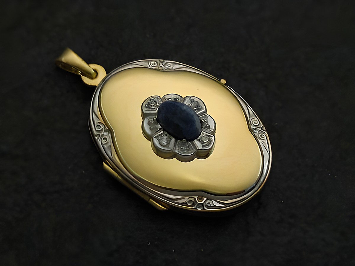 Medaillon aus Gold 585 bicolor mit Sodalit blau Cabochon, umgeben von einer blütenförmigen Anordnung und feinen Details, hergestellt von Juwelier Harnisch.