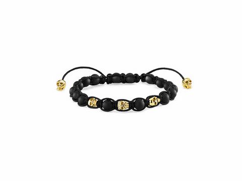 Schwarzes Armband von Thomas Sabo mit Totenkopfmotiven, verstellbar von 15 bis 21 cm, versehen mit goldfarbenen Akzenten, stilvolles und modernes Accessoire.