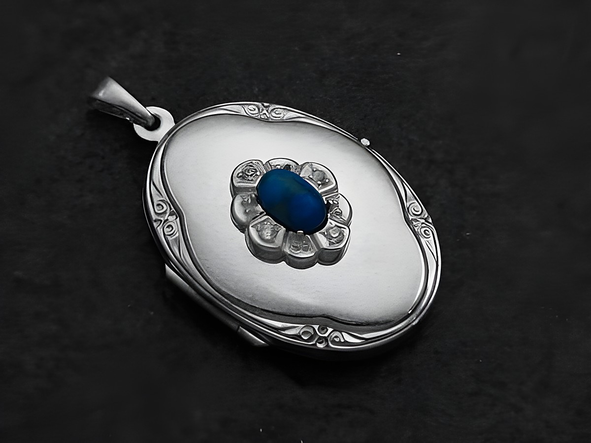 Medaillon aus Weißgold 585 mit blauem Howlite Cabochon und Brillanten, feine Details und elegantes Design, hergestellt von Juwelier Harnisch.