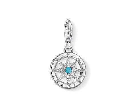 Thomas Sabo Kompass Charm 1228-405-17 aus Silber mit türkisfarbener Zirkonia in der Mitte, filigranes Design mit einer Kompassrose, ideal für Schmuckliebhaber.