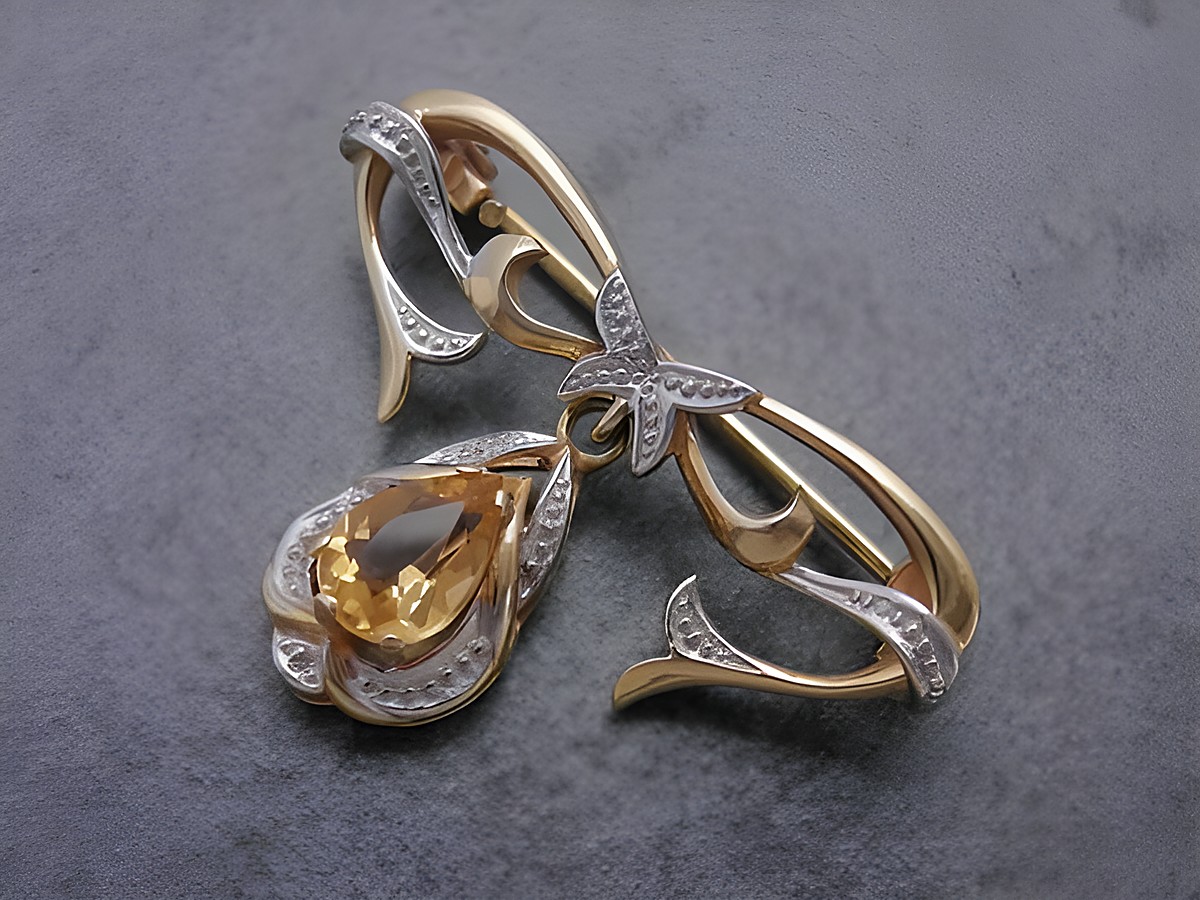 Gold Brosche anmutig Gold 333 mit Citrin Anstecknadel, Hersteller Juwelier Harnisch, filigrane Verarbeitung mit geschwungenen Formen und einem tropfenförmigen Citrin.