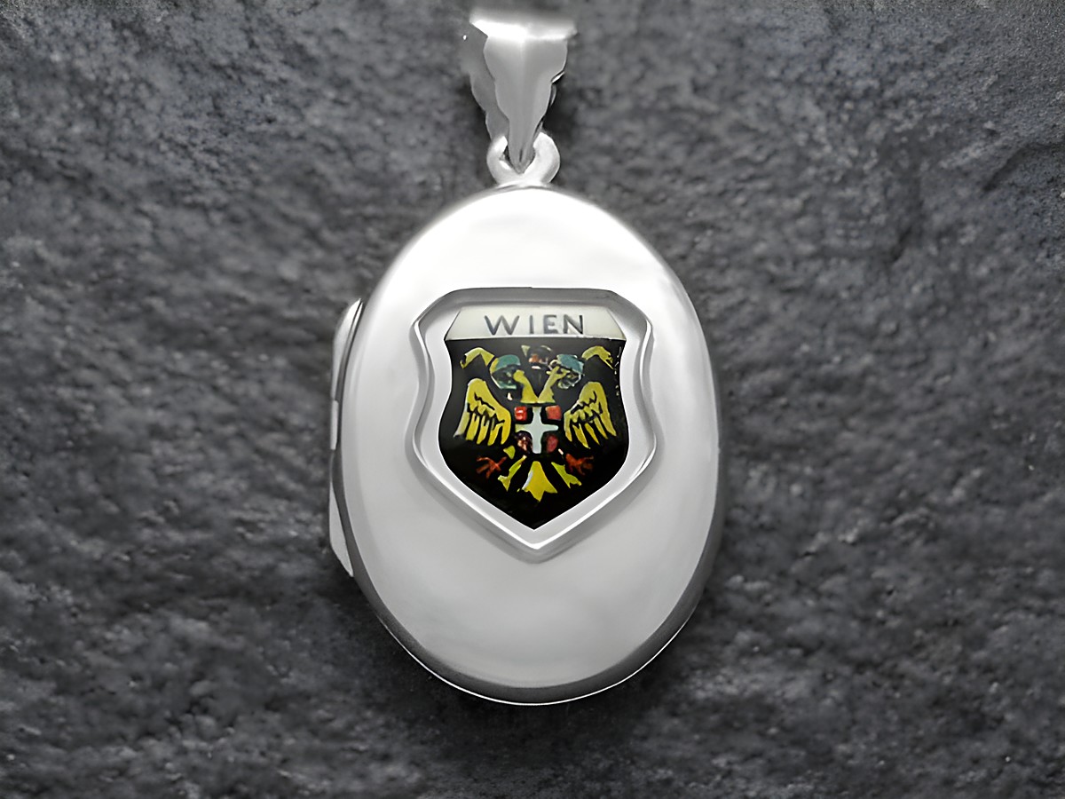 Silbernes Medaillon mit dem Stadtwappen von Wien, zeigt den Adler und die Inschrift Wien, Hersteller Juwelier Harnisch, ideal für Sammler und Wien-Liebhaber.