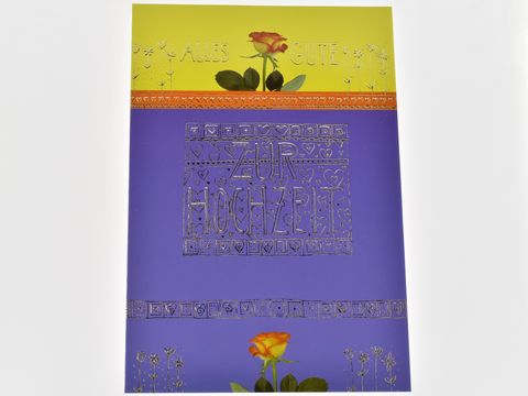 Hochzeitskarte mit buntem Design, gelber und lila Grundfarbe, geschmückt mit einer roten Rose, in der Mitte der Aufschrift zur Hochzeit sowie der Botschaft alles Gute, Hersteller Juwelier Harnisch.