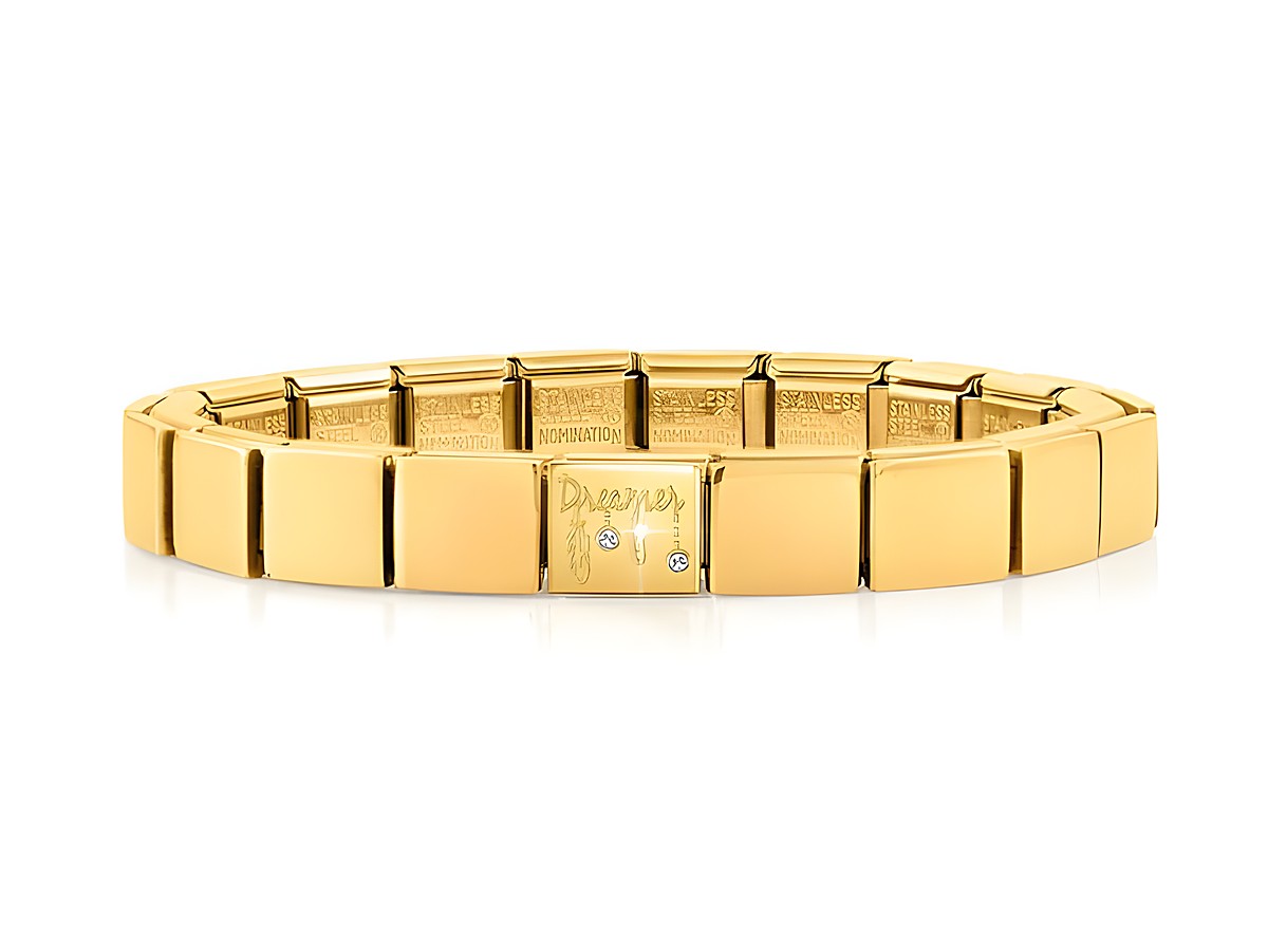 Edelstahl Armband in Gelbgold mit dem Schriftzug Dreamer und zwei kleinen Schmucksteinen, glänzende Oberflächen mit klassischem Design, perfekt für Eleganz und Stil.