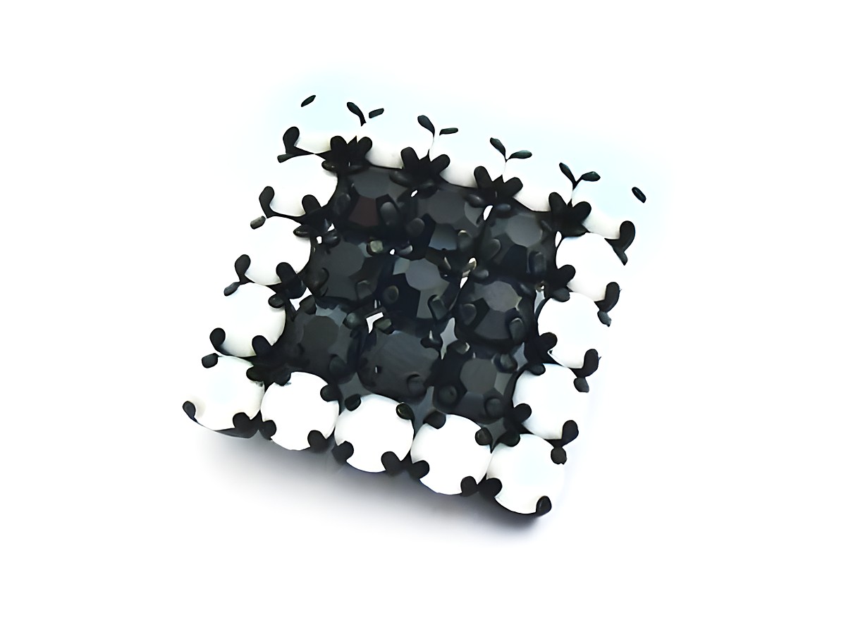 Schwarz-weiße Strass Brosche im sexy City Look, hergestellt von Juwelier Harnisch. Die Brosche besticht durch ihr elegantes Design und die auffällige Farbgebung in Schwarz.