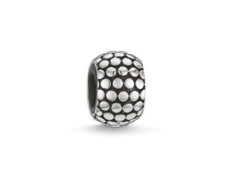 Silberner Stopper aus hochwertigem Silikon von Thomas Sabo, Modell KS0001-585-12, mit runder, strukturierter Oberfläche, ideal als Zubehör für Armbänder oder Charms.