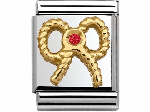 Edelstahl Charm von Nomination mit goldener Schleife und rotem Zirkonia Stein, symbolisiert Eleganz und Stil, für die individuelle Gestaltung von Armbändern geeignet.