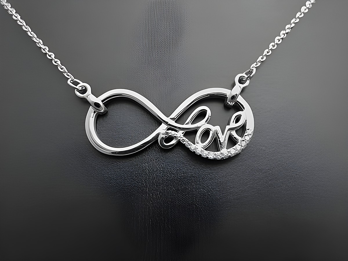Silber Collier - Unendliche Liebe rhodiniert mit Zirkonia, 42-45,5 cm, Hersteller: Juwelier Harnisch, inkl. Kette, filigranes Design in Form des Unendlichkeitssymbols mit dem Wort Love.