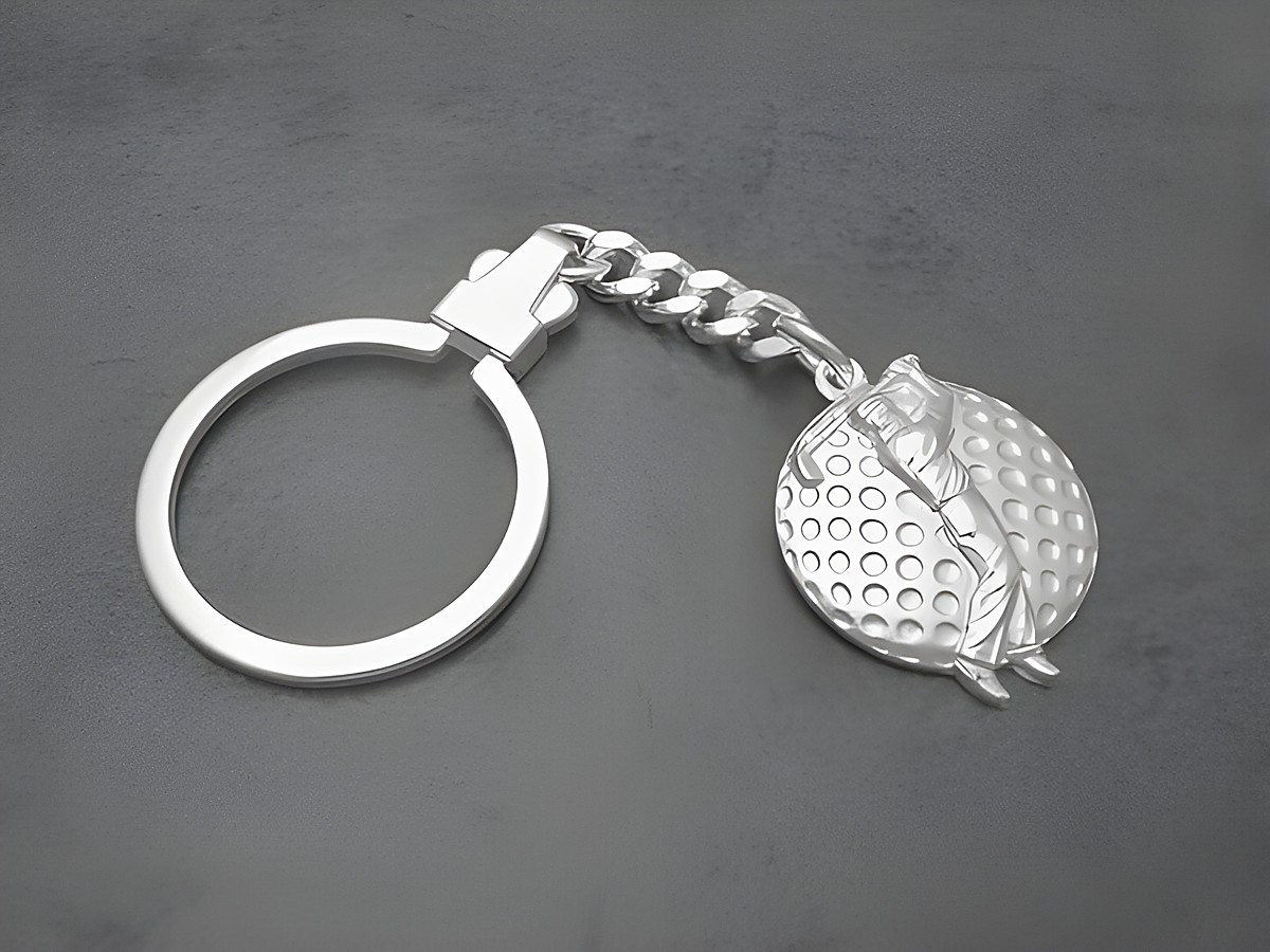 Schlüsselanhänger Golfer aus echtem Sterling Silber von Juwelier Harnisch, eine schöne Geschenkidee mit einem detaillierten Golfer und Golfball-Design.