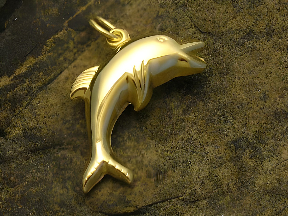 Ein glänzender Delphin-Anhänger aus Gold 333, gefertigt von Juwelier Harnisch, der die Form eines Delphins darstellt und ideal für Tierliebhaber ist.