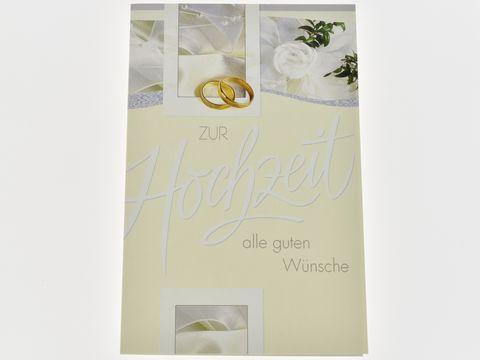 Cremeweiße Hochzeitskarte mit eleganten Hochzeitsmotiven, goldenen Ringen und einem floralen Dekor, verziert mit dem Schriftzug zur Hochzeit, Hersteller Juwelier Harnisch.