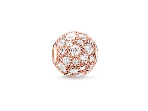 Karma Bead von Thomas Sabo aus Sterling Silber, vergoldet mit Roségold, besetzt mit weißen Zirkonia, in einer runden Form mit crushed Pavé-Oberfläche.