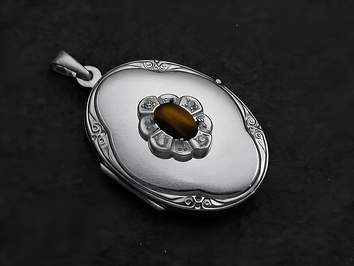 Medaillon aus Weißgold 585 mit einem ovalen Tigerauge-Cabochon in der Mitte, umgeben von Brillanten, gefertigt vom Juwelier Harnisch, feine Details und elegantes Design.