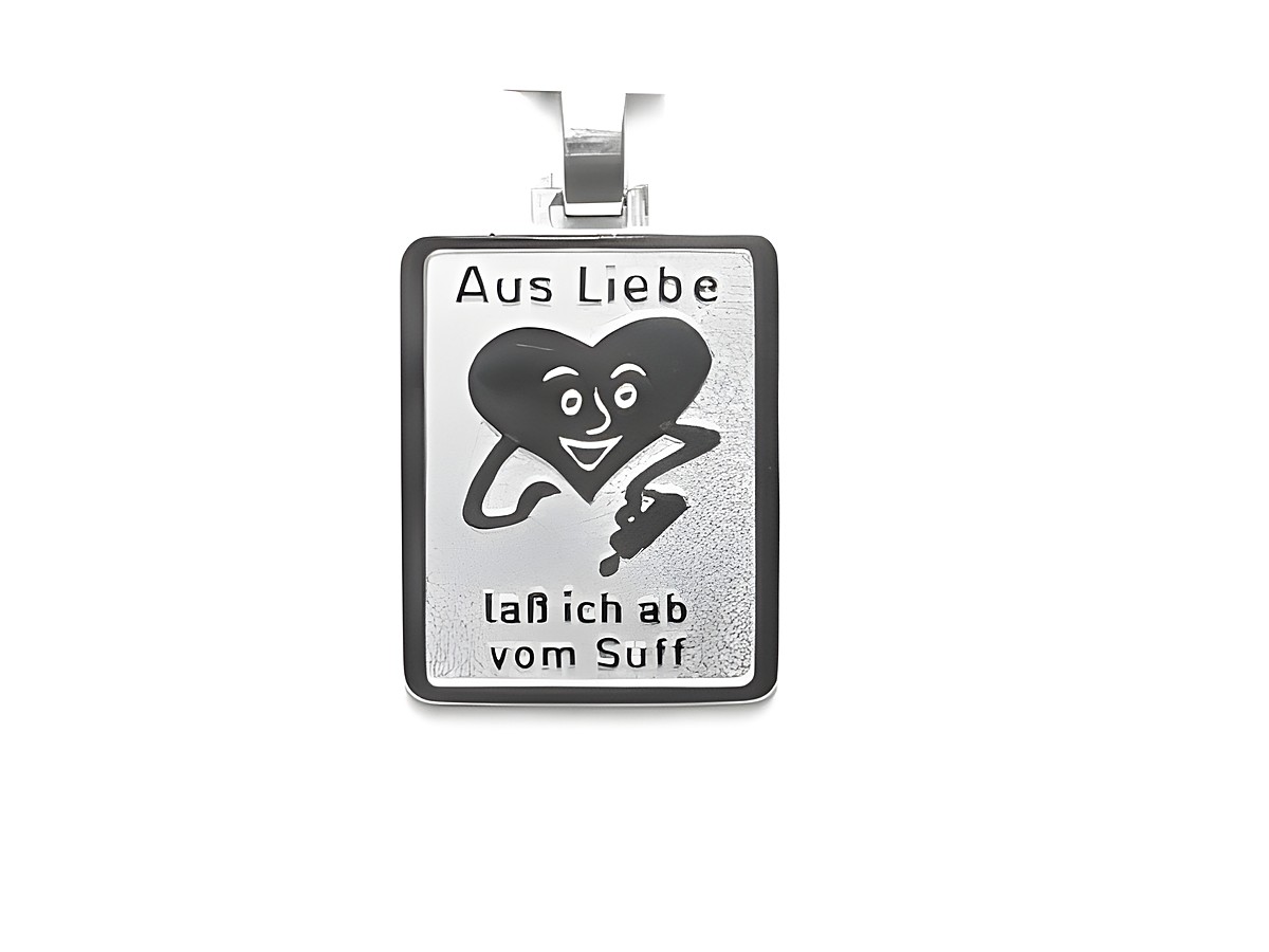 Silber Anhänger des Juweliers Harnisch mit dem Motiv eines lächelnden Herzens und dem Text Aus Liebe laß ich ab vom Suff.