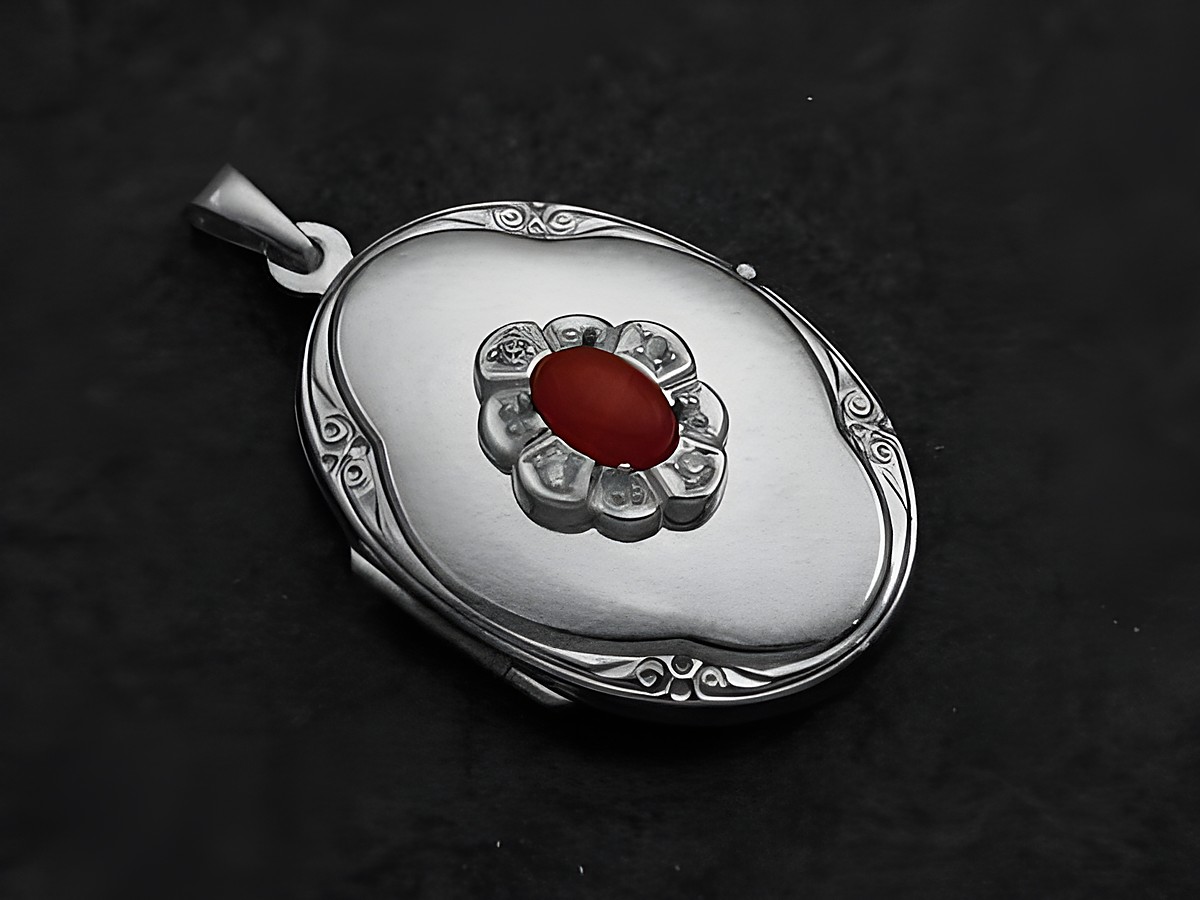 Karneol rot-braun Medaillon Cabochon aus Weißgold 585 von Juwelier Harnisch, ovales Design mit blütenförmiger Anordnung kleiner Diamanten um den zentralen Karneol.