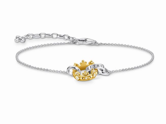 Vergoldetes Armband von Thomas Sabo mit dezenter Verzierung, bestehend aus einer feinen Kette und einem geschwungenen Element, das mit strahlenden Steinen glänzt.