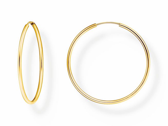 Mittelgroße Creolen von Thomas Sabo in Silber mit Gelbgoldvergütung, elegant und zeitlos, geeignet für jeden Anlass und ein stilvolles Accessoire.