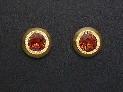 Ohrringe in orange-braun facettiert mit Gold Ohrsteckern vom Juwelier Harnisch, verziert mit weiteren Steinen, elegant und glänzend, ideal für besondere Anlässe.