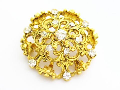Brosche im Sexy City Look in Gold mit weißen Strasssteinen, Hersteller Juwelier Harnisch, filigranes Design, runde Form, luxuriöse Akzente für jeden Anlass.