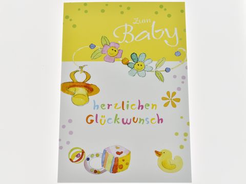 Glückwunschkarte zum Baby mit bunten Blüten, Schnuller und Babyspielzeug. Hersteller Juwelier Harnisch, Glückwunschkarten. Freundliches und fröhliches Design in Gelb und Pastellfarben.