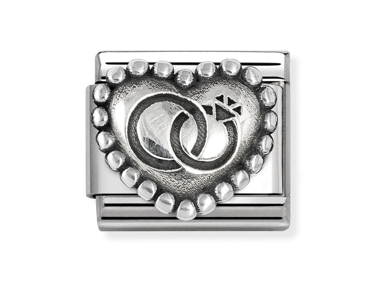 Nomination 330101 90 CLASSIC Element - oxidiertes Sterling Silber - Eheringe in Kugelherz Eheringe aus oxidiertem Sterling Silber in Form eines Kugelherzs mit eingravierter Motivik, von Nomination, Artikelnummer 330101 90 CLASSIC, ideal als Symbol der Verbundenheit.