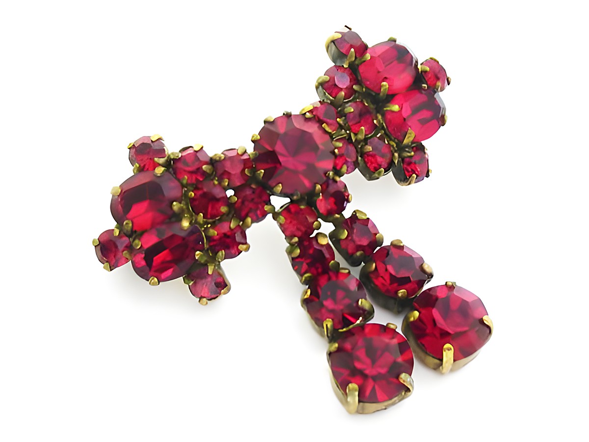 Rote Strass Damen Designer Brosche im Sexy City Look von Juwelier Harnisch, funkelnde rote Strasssteine in goldfarbener Fassung, ideal für stilvolle Akzente.