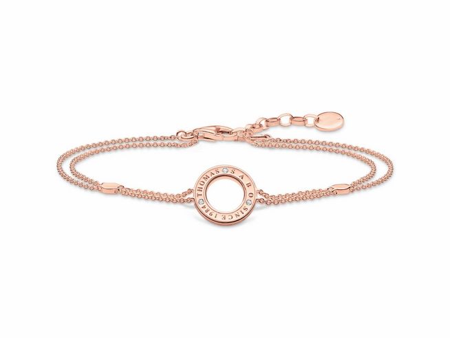 Armband von Thomas Sabo in roségold, verziert mit Zirkonia, features einen runden Anhänger mit Gravur und feinem Kettendesign, verstellbar von 16 bis 19 cm.