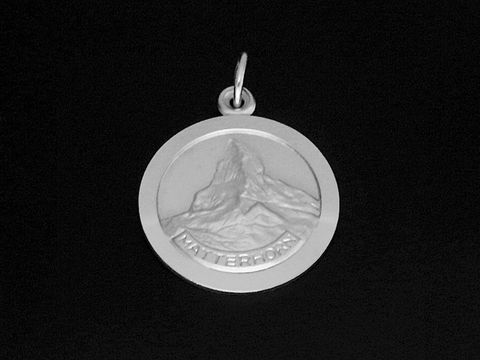 Matterhorn Anhänger aus Silber rhodiniert, rund mit eingeprägtem Matterhorn-Motiv. Hersteller Juwelier Harnisch, ideal als persönliches Schmuckstück oder Geschenk.