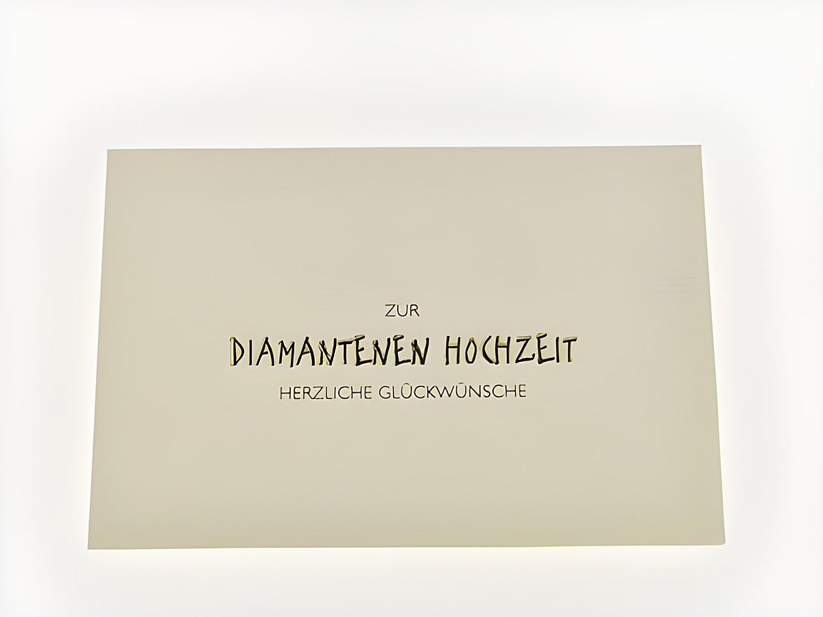 Hochzeitskarte aus Strukturpapier mit goldener Schrift, elegant gestaltet, Hersteller Juwelier Harnisch, ideal für Diamantene Hochzeit, herzliche Glückwünsche.