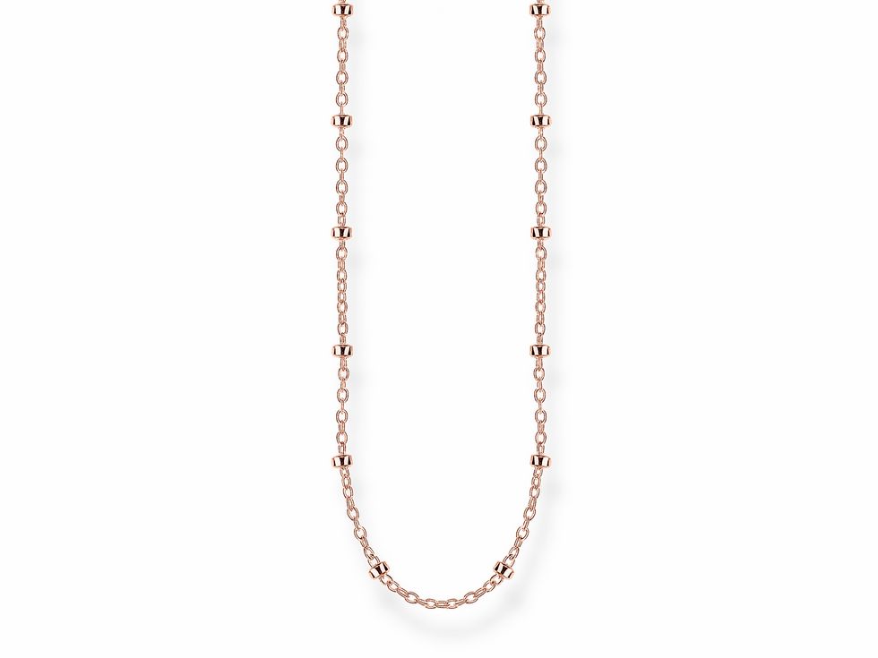 Kette aus Sterling Silber, vergoldet in Roségold, von Thomas Sabo, ohne Anhänger, mit abwechselnd glatten und geriffelten Elementen, elegantes Design in roségoldfarben.