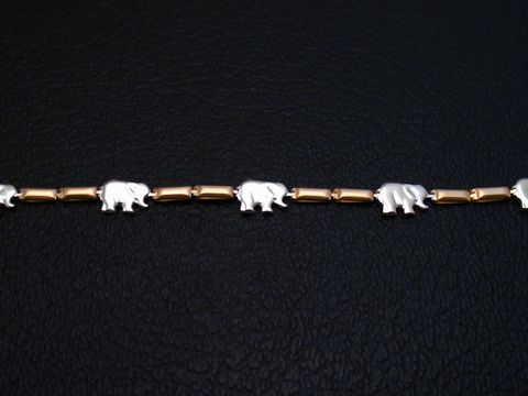 Kette Elefanten aus Gold 585 in bicolor mit einer Länge von 45 cm, Hersteller Juwelier Harnisch, zeigt stilisierte Elefanten in einer ansprechenden Anordnung.