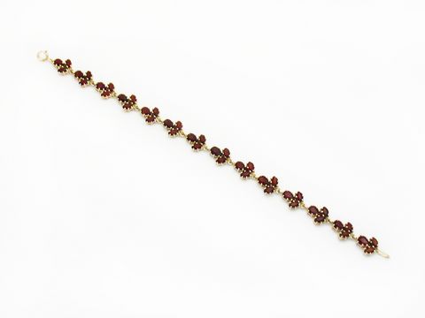 Granat Armband 19 cm aus vergoldetem Silber mit facettierten Granatsteinen, elegant verarbeitet, ideal für Schmuckliebhaber, Hersteller Juwelier Harnisch.