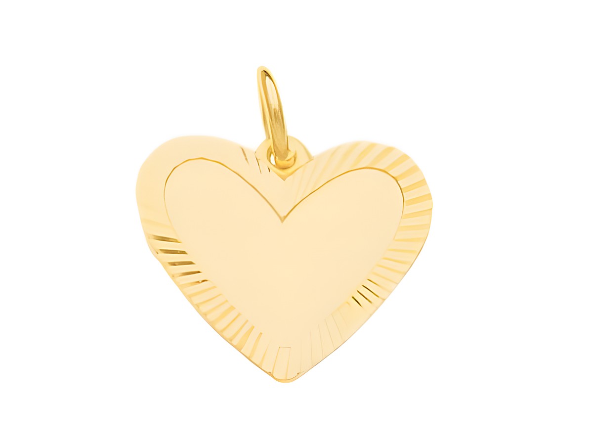 Ein Anhänger in Herzform aus Doublé Gold mit einer gravierbaren Plattenfläche. Hergestellt von Juwelier Harnisch und ideal zum Personalisieren.