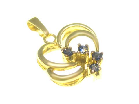 Gold Anhänger mit poliertem Finish, verziert mit mehreren Saphiren, Hersteller Juwelier Harnisch, elegantes Design, ideal als Schmuckstück für besondere Anlässe.