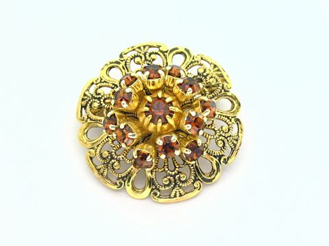 Damen Brosche im sexy City Look, braun rund, Hersteller Juwelier Harnisch, mit Strass in Gelb und Braun, filigranes Design, ideale Ergänzung für elegante Outfits.