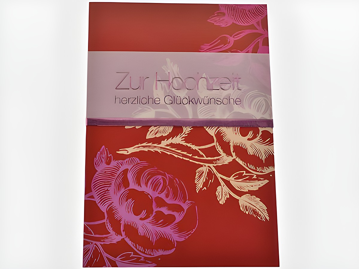Rote Hochzeitskarte mit floralen Elementen und einem farblich abgesetzten Aufdruck, Hersteller Juwelier Harnisch, geeignet für herzliche Glückwünsche zur Hochzeit.