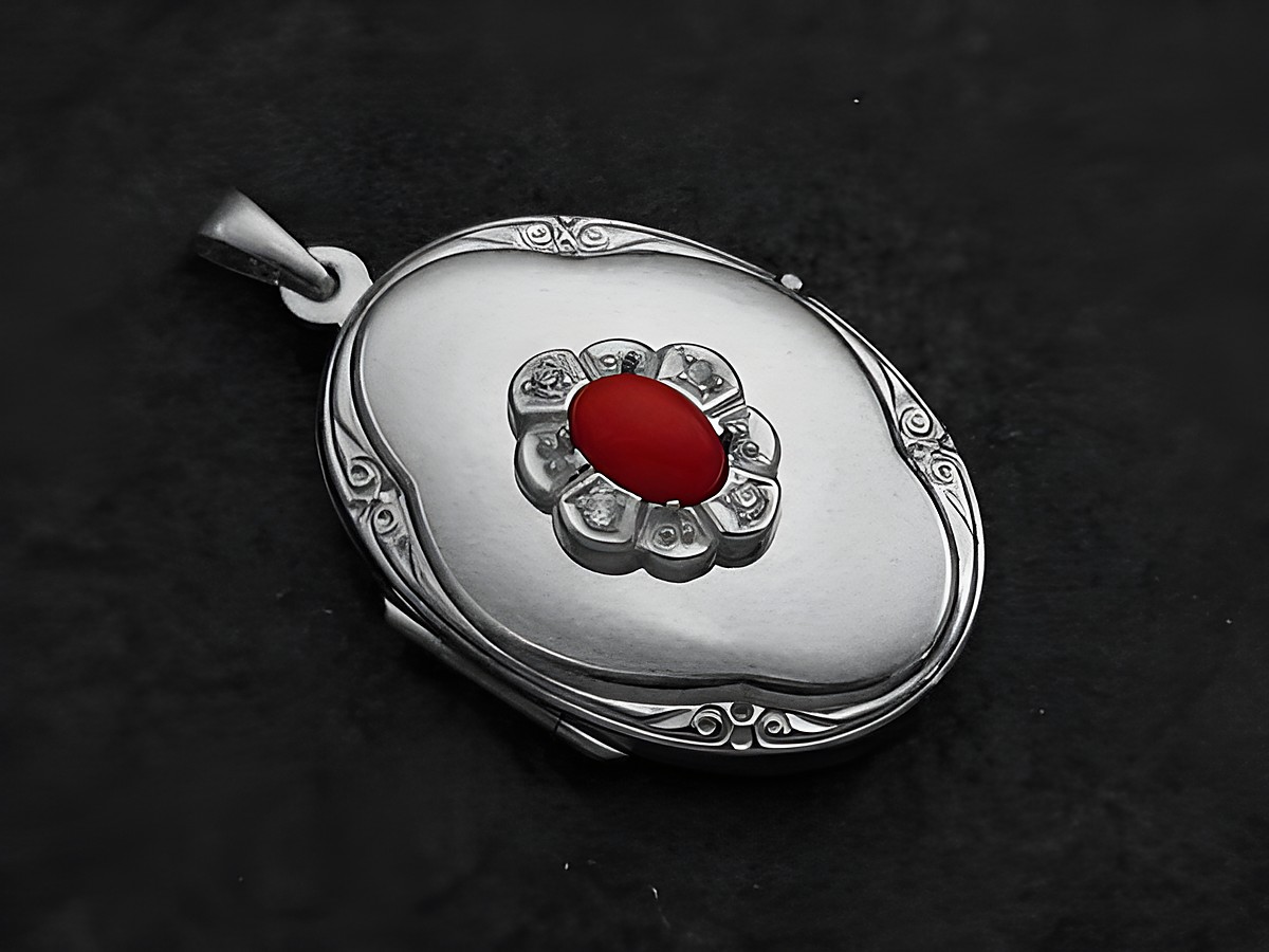 Koralle rot Medaillon Cabochon aus Sterling Silber mit Zirkonia von Juwelier Harnisch, oval geformt und elegant verziert, ideal für stilvolle Schmuckliebhaber.