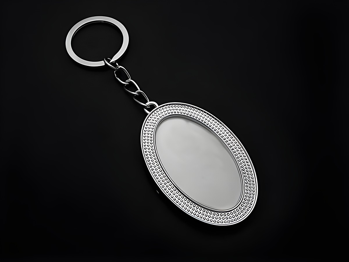 Schlüsselanhänger in ovaler Form mit Fotorahmen, Länge 12 cm, silberfarben, Hersteller Juwelier Harnisch, ideal zur individuellen Gestaltung.