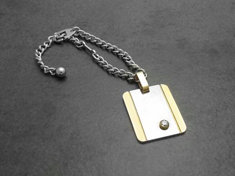 61287-0 Edelstahl Schlüsselanhänger mit Vergoldung, Hersteller: Juwelier Harnisch, aus Edelstahl mit einem eleganten Design und einem funkelnden Element, ideal für stilvolle Accessoires.