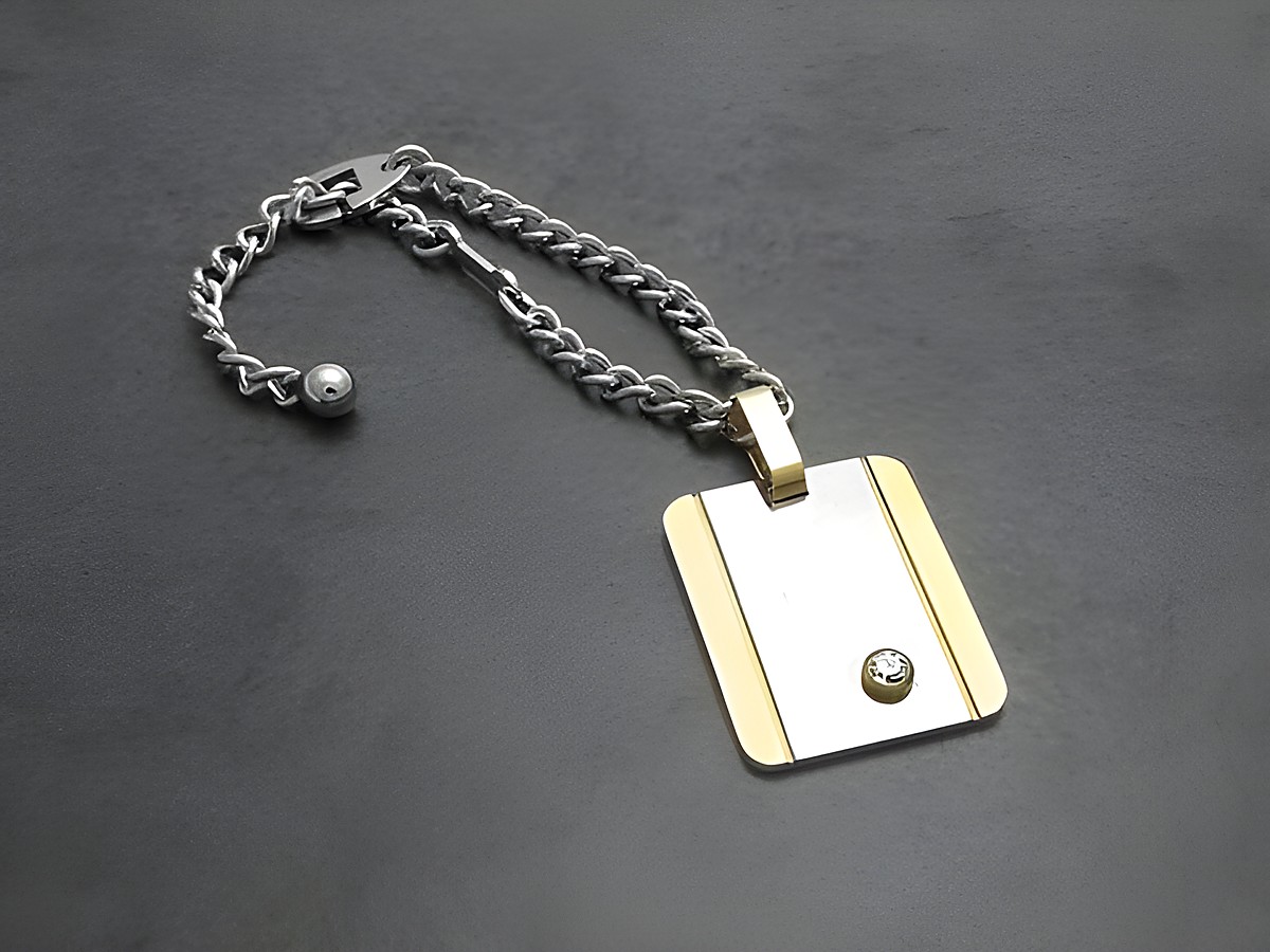 Edelstahl Schlüsselanhänger mit Vergoldung, Hersteller: Juwelier Harnisch, aus Edelstahl mit einem eleganten Design und einem funkelnden Element, ideal für stilvolle Accessoires.