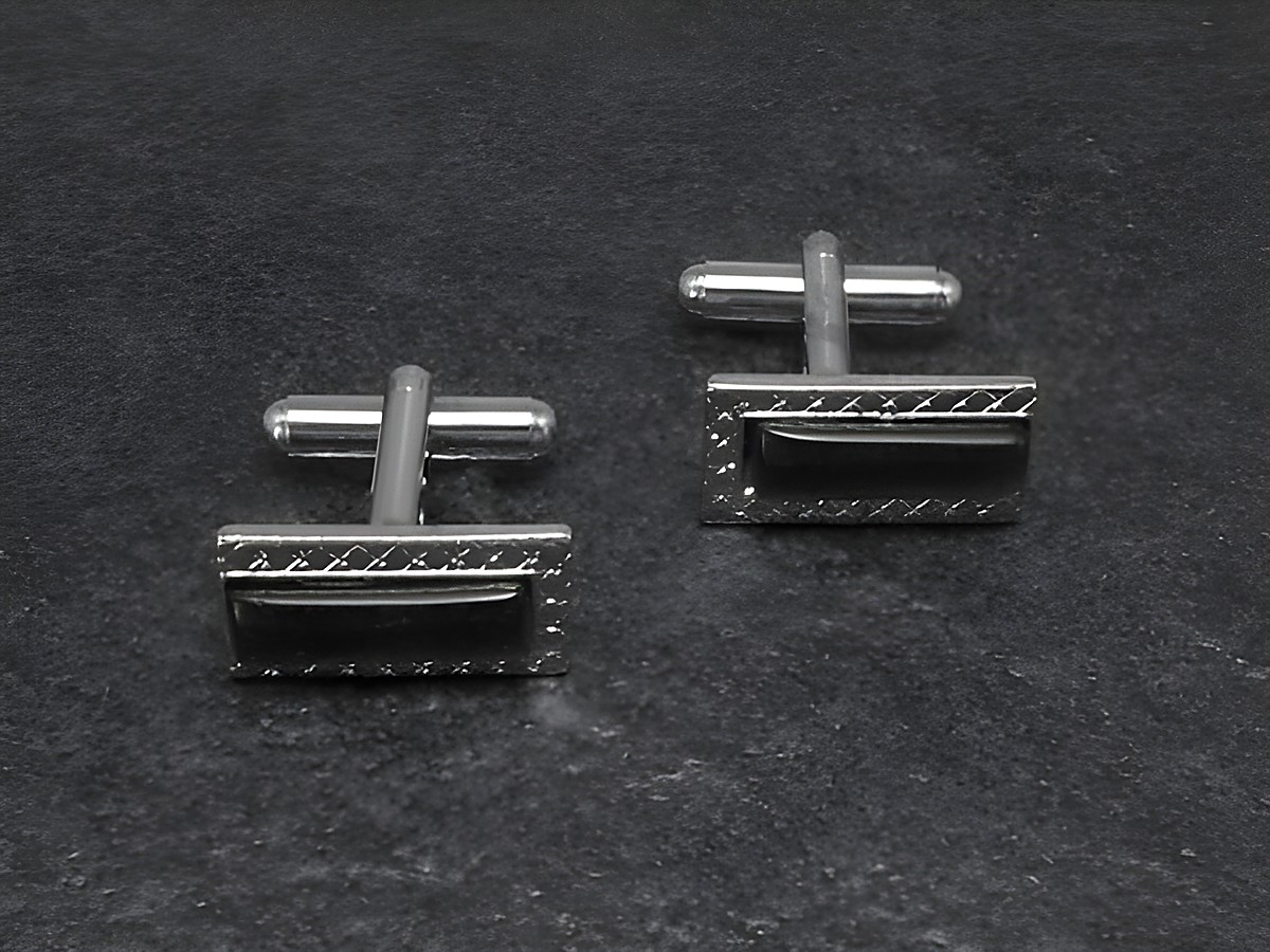 Manschettenknöpfe grau Design 18,9 mm silberfarben von Juwelier Harnisch, elegante rechteckige Form mit feiner Musterung, ideal für formelle Anlässe und stilvolle Outfits.