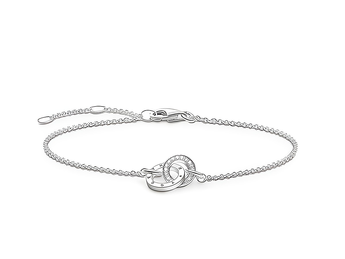 Silbernes Armband von Thomas Sabo mit Diamanten in weiß, designed mit einer Verzierung aus zwei miteinander verbundenen Elementen, Länge 19,5 cm.