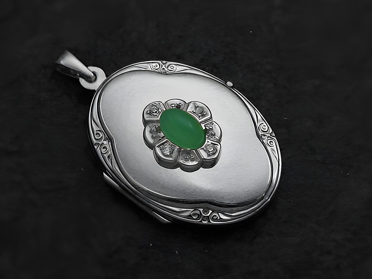 Chrysopras Grün Medaillon Cabochon in Weißgold 585, von Juwelier Harnisch, oval geformt mit feiner Umrandung und funkelnden Details, edel und zeitlos.