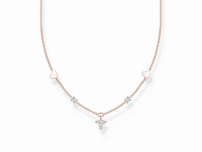 Eine eleganten Thomas Sabo Kette aus vergoldetem Roségold, 42 cm verstellbar, mit Herz- und Zirkonia-Anhängern in einer feinen Gestaltung. Ideal für besondere Anlässe.