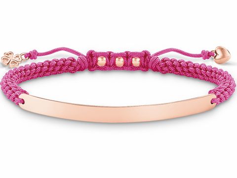 Makramee Armband von Thomas Sabo in pink mit einer glänzenden Roségold-Platte und kleinen roségoldenen Details, verstellbar von 15 bis 21 cm, feminin und stylish.