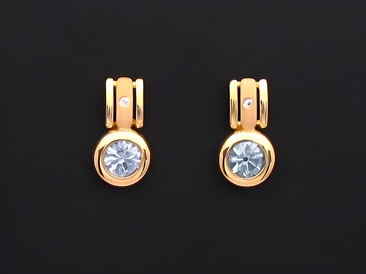 Elegante Gold Ohrringe mit synthetischen Erinitsteinen, hochwertig verarbeitet von Juwelier Harnisch, ideal für festliche Anlässe.