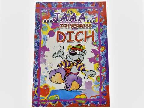 Die Grußkarte zeigt eine Lümmel-Figur in buntem Cartoon-Stil mit der Aufschrift "JAAAA... ICH VERMISS DICH". Der Hintergrund ist farbenfroh und mit Herzen verziert.