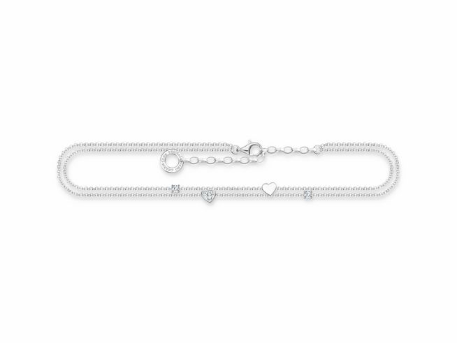 Thomas Sabo Fußkette aus Sterling Silber mit Zirkonia, verstellbar auf 27 cm, zierliche Kette mit Anhängern in Herz- und Steinform, elegantes Design für stilvolle Fußbekleidung.