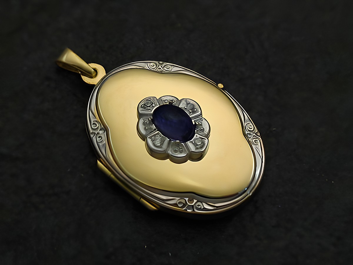 Iolite blau Medaillon Cabochon Gold 585 bicolor, mit filigraner Verzierung und zentrales ovales Iolite. Hersteller: Juwelier Harnisch, Gold 585. Elegantes Schmuckstück für besondere Anlässe.